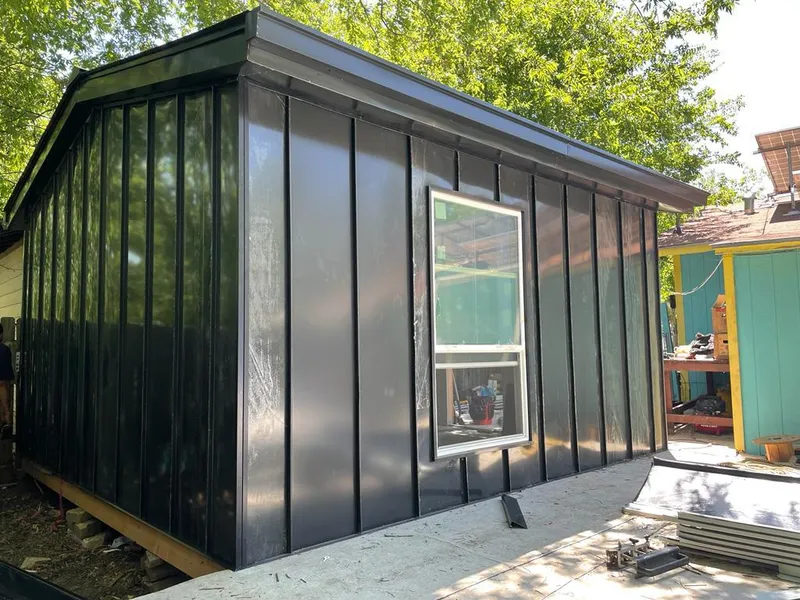 Black standing seam metal wall panels for Roof Inspection in Bastrop